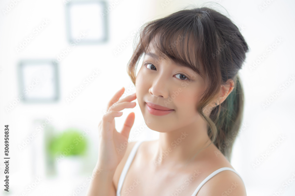Portrait of beautiful young asian woman smile while wake up healthy and wellness with sunrise at morning in the bedroom, asia girl skin care with happy with fresh, lifestyle and relax concept. Portrait of beautiful young asian woman smile while wake up healthy and wellness with sunrise at morning in the bedroom, asia girl skin care with happy with fresh, lifestyle and relax concept.