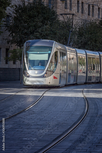 City tram in movement to a stop for disembarkation and boarding of passengers
