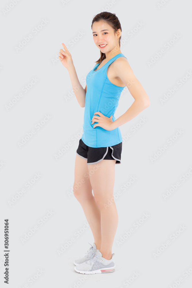 Beautiful portrait young asian woman in sport workout confident pointing and presenting and show something isolated on white background, asia girl exercise for fit with health and wellness concept. Beautiful portrait young asian woman in sport workout confident pointing and presenting and show something isolated on white background, asia girl exercise for fit with health and wellness concept.