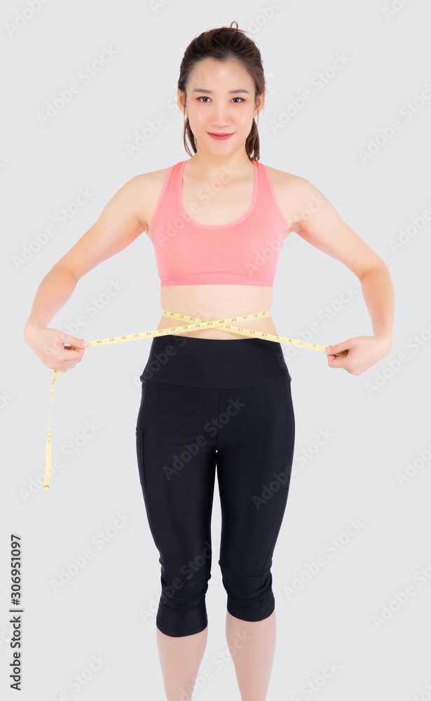 Beautiful slim young asian woman measuring tape thin waist wear uniform fitness isolated white background, asia girl loss weight for diet with exercise and workout wellbeing and healthy care body. Beautiful slim young asian woman measuring tape thin waist wear uniform fitness isolated white background, asia girl loss weight for diet with exercise and workout wellbeing and healthy care body.