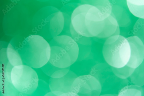 Abstract circular green bokeh background.