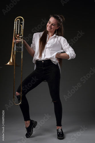 A life-size portrait of a girl with a trombone photo