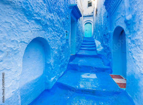 Typical street of Chefchaouen, Morocco with blue walls and bright doors © leelook