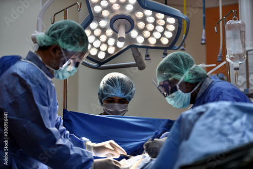 Medical Team Performing Surgical Operation in Modern Operating Room. Equipment and medical devices in hybrid operating room