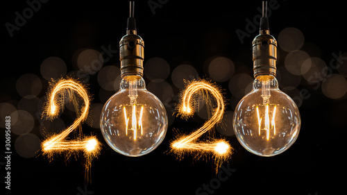 Luxury beautiful retro or vintage dirty light bulb decor hanging with 2020 Happy new year concept written number by sparkle firework