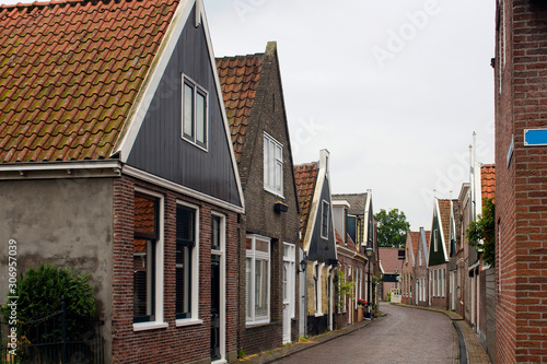View of historical, traditional and typical houses in Edam. It is a town famous for its semi hard cheese in the northwest Netherlands, in the province of North Holland. © theendup