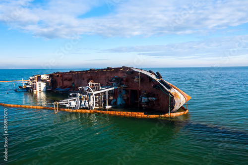 damaged ship near the coast breakwater