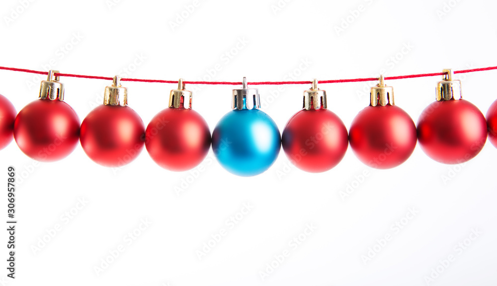 Line of red and blue christmas balls on white background. Christmas decorations. Line of red and blue christmas balls on white background. Christmas decorations.