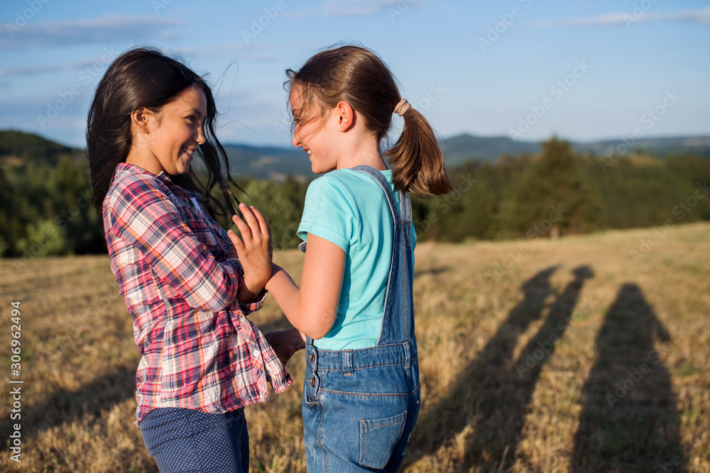 Two school children walking on field trip in nature, playing. Two school children walking on field trip in nature, playing.