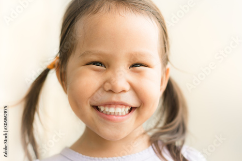 Portrait of a happy confident child smiling.