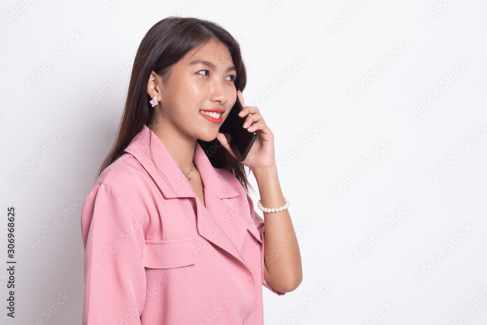 Young Asian woman talking with mobile phone. Young Asian woman talking with mobile phone.