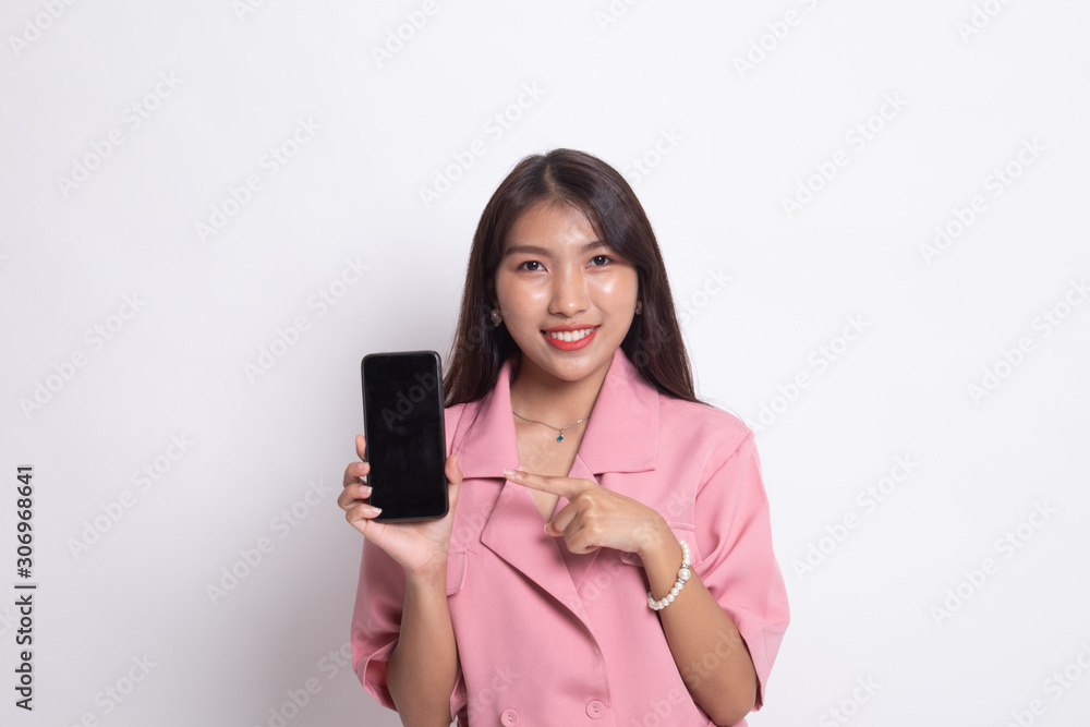 Young Asian woman point to mobile phone. Young Asian woman point to mobile phone.