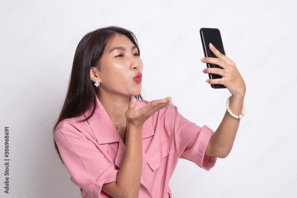 Young Asian woman with mobile phone. Young Asian woman with mobile phone.
