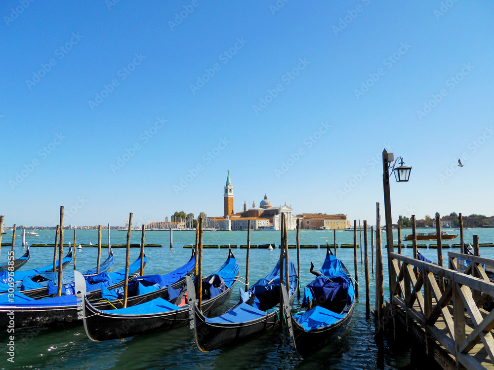 Gondolas at Traghetto Gondole Molo in Venice, Italy
