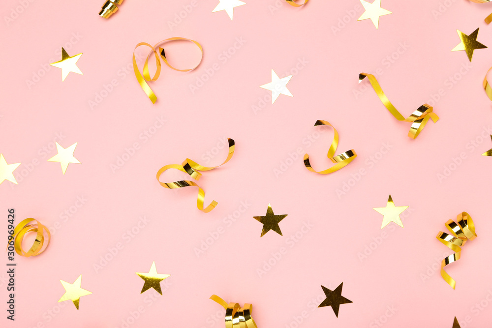 Golden ribbons and stars on pink background Golden ribbons and stars on pink background