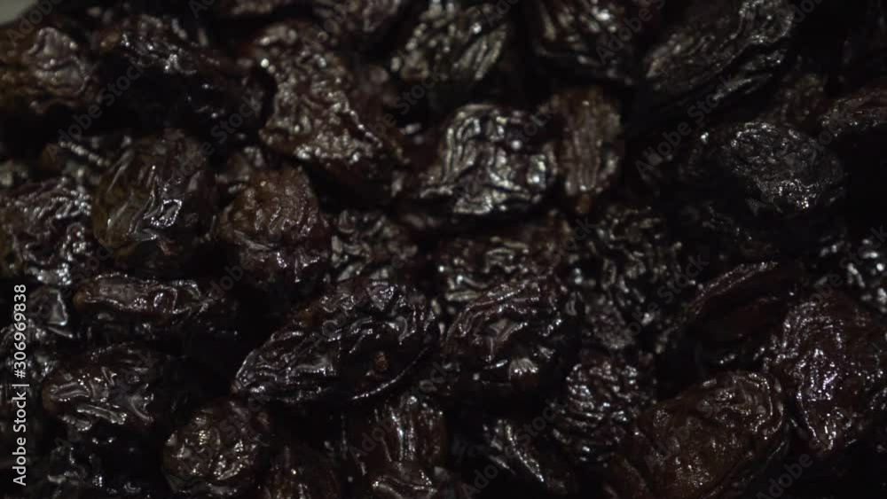 Pile of prunes closeup video in a slow motion. Pile of prunes closeup video in a slow motion.