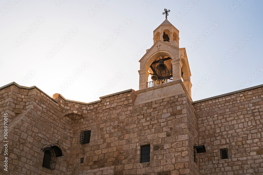 backlit bell tower belfry of the christian church of the nativity in bethlehem west bank palestine showing the texture of the stone walls