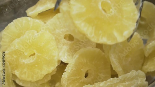 Picking dry pineapple on a farmers market. Slow motion video.