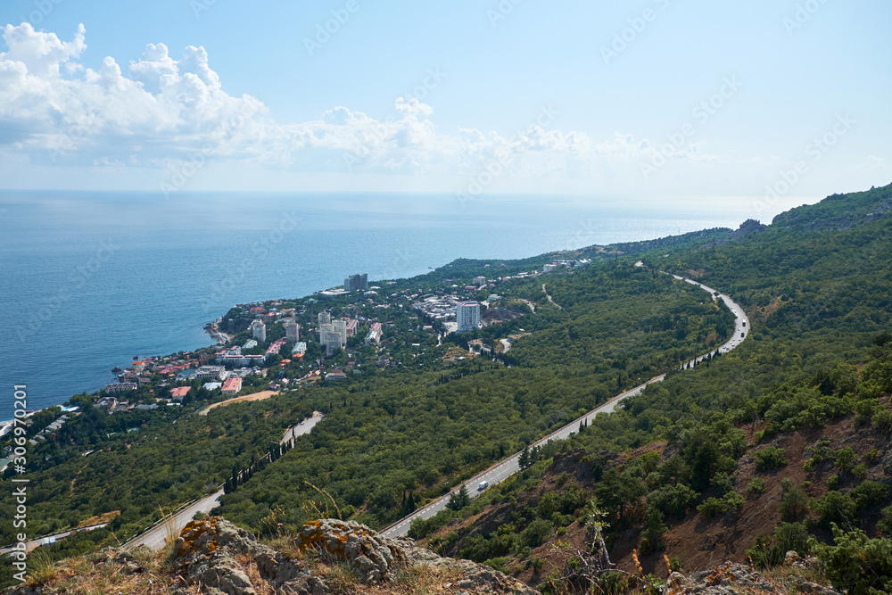 Road in the mountains with seascape