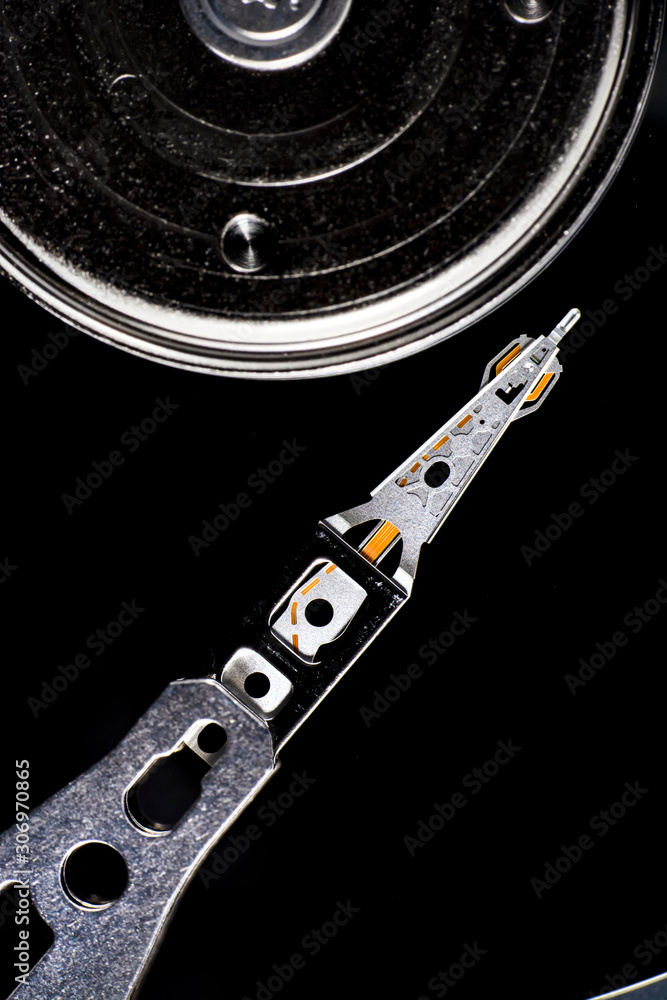 Disassembled hard drive from the computer, hdd with mirror effect. Opened hard drive from the computer hdd disk drive with mirror effects. Part of computer pc, laptop. Disassembled hard drive from the computer, hdd with mirror effect. Opened hard drive from the computer hdd disk drive with mirror effects. Part of computer pc, laptop.