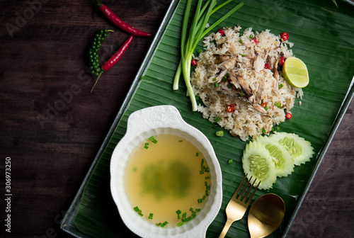 Fried rice with mackerel and egg on wood table,Thai food