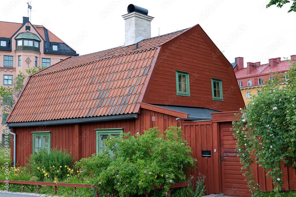 Traditional wooden house painted in traditional red located in Stockholm, Sweden Traditional wooden house painted in traditional red located in Stockholm, Sweden