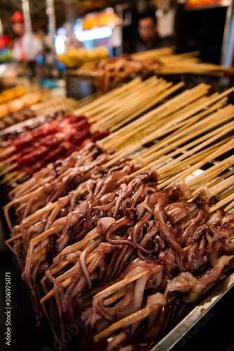 Fried and rosted octopus in a food market in Beijing, China.