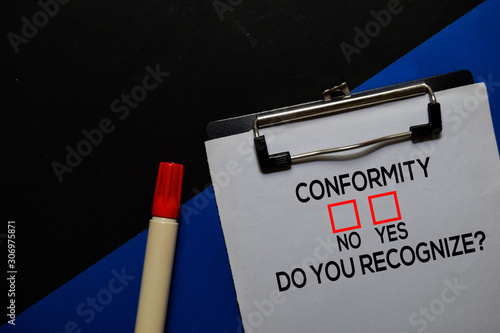 Conformity, Do You Recognize? Yes or No. On office desk background photo
