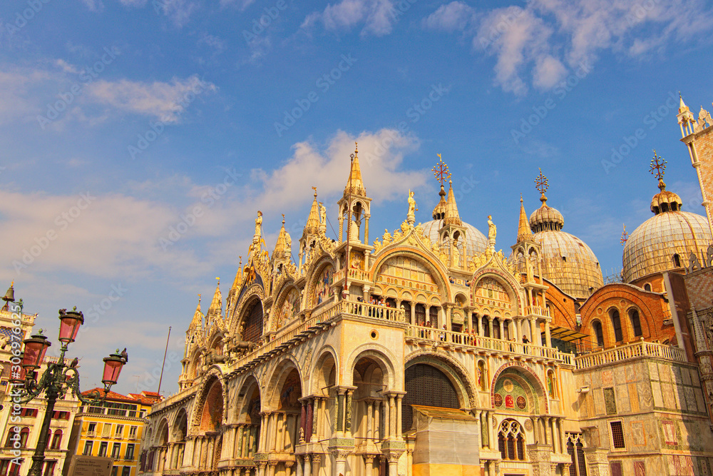 Venice, Italy-September 28,2019:Picturesque landscape view of The Patriarchal Cathedral Basilica of Saint Mark with crowed of tourists. Beautiful autumn sunny day. Popular travel destination in Venice