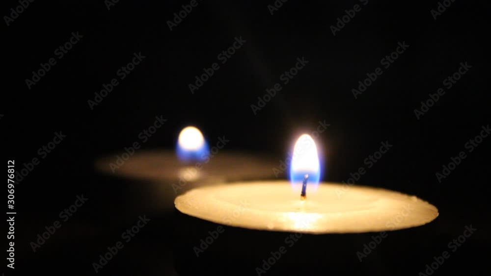 burning candle in the dark, candlelight in the night glowing , black background burning candle in the dark, candlelight in the night glowing , black background