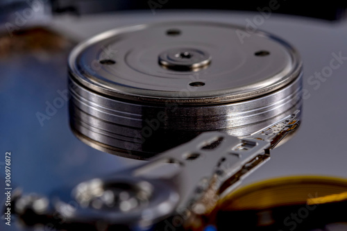 Wallpaper Mural Disassembled hard drive from the computer, hdd with mirror effect. Opened hard drive from the computer hdd disk drive with mirror effects. Part of computer pc, laptop. Torontodigital.ca