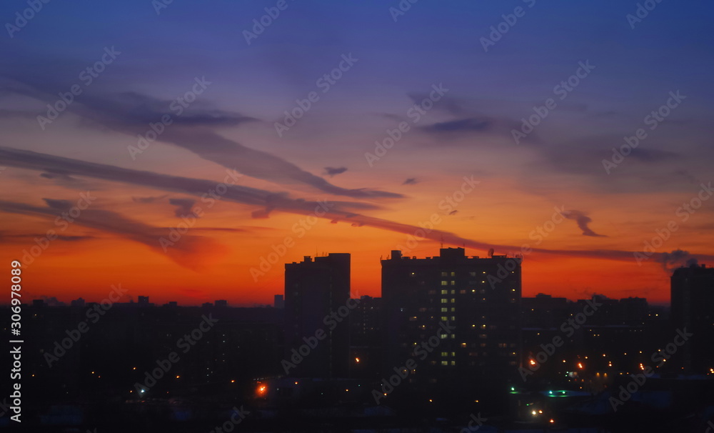 Naklejka premium Night sky over houses of metropolis