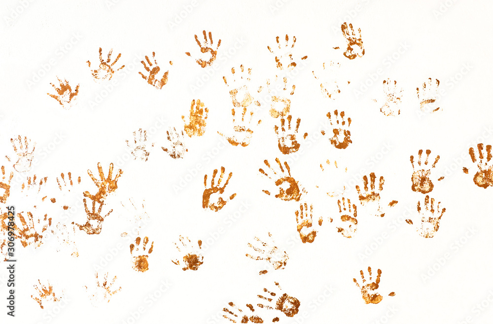 Imprints of human palms on the wall for your creative project in the style of primitive art. Abstract texture from various of dirty handprint in brown tones isolated on white background.