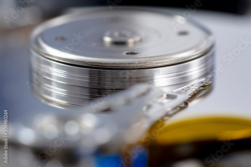 Wallpaper Mural Disassembled hard drive from the computer, hdd with mirror effect. Opened hard drive from the computer hdd disk drive with mirror effects. Part of computer pc, laptop. Torontodigital.ca