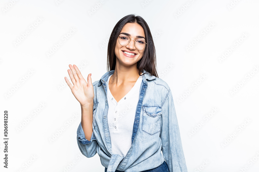 Happy teenage girl waving a greeting , isolated on white background Happy teenage girl waving a greeting , isolated on white background