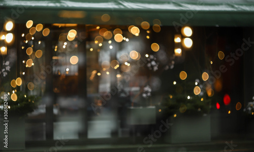 Christmas blurry lights on the street and Christmas tree © Irina