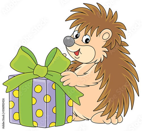 Cute little hedgehog holdin...