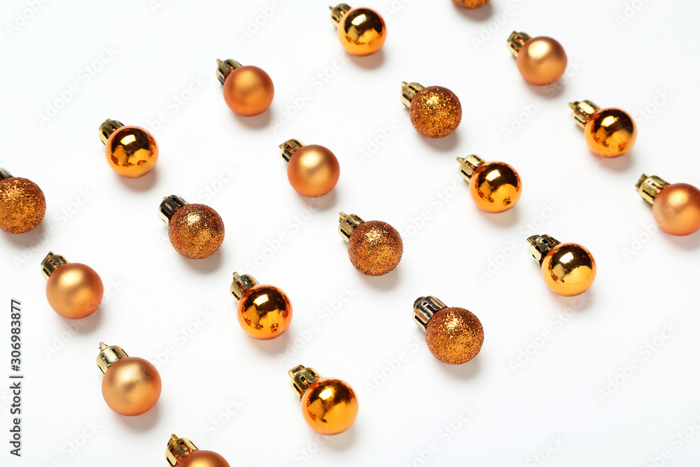 Flat lay christmas composition. Golden baubles on white background Flat lay christmas composition. Golden baubles on white background