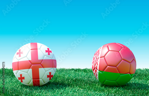 Two soccer balls in flags colors on green grass. Georgia and Belarus. 3d image