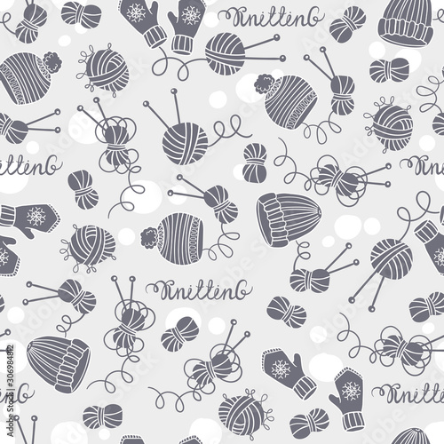 Vector seamless pattern with hats, mittens, balls of yarn and knitting needles. Background on the theme of hobby and knitting