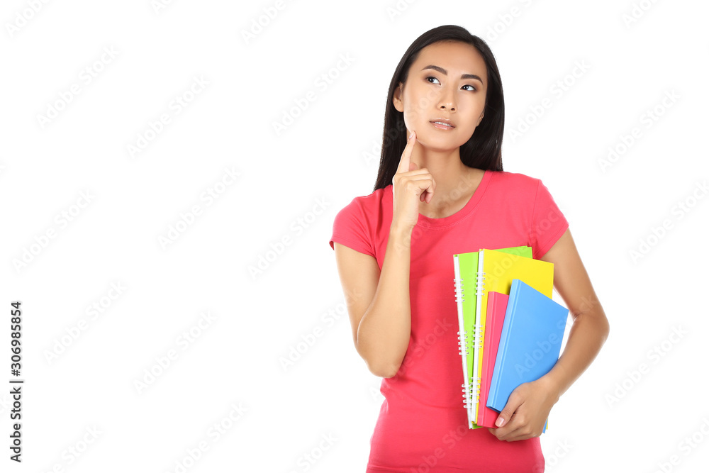 Young woman with books and notepads isolated on white background Young woman with books and notepads isolated on white background