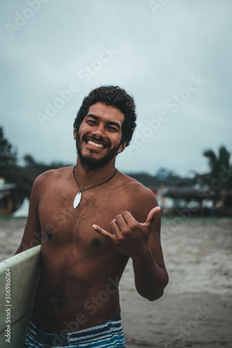  Black boy surfer on the beaches of Montañita, Ecuador
