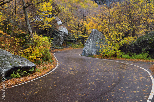 Winding road through boulders at Smugglers Notch State Park Vermont