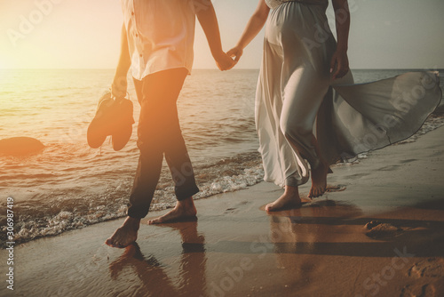 Bride and groom at a photo session in the nature. Baltic sea beach