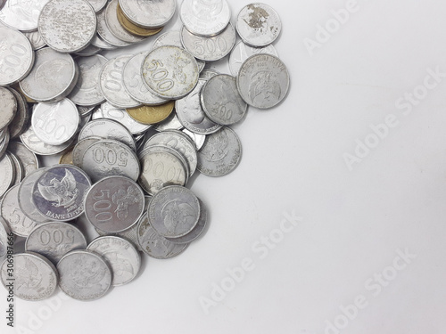 Scattered Abstract Symbolic Concept Pile Stack of Indonesian Rupiah Money Coins Riches in White Isolated Background