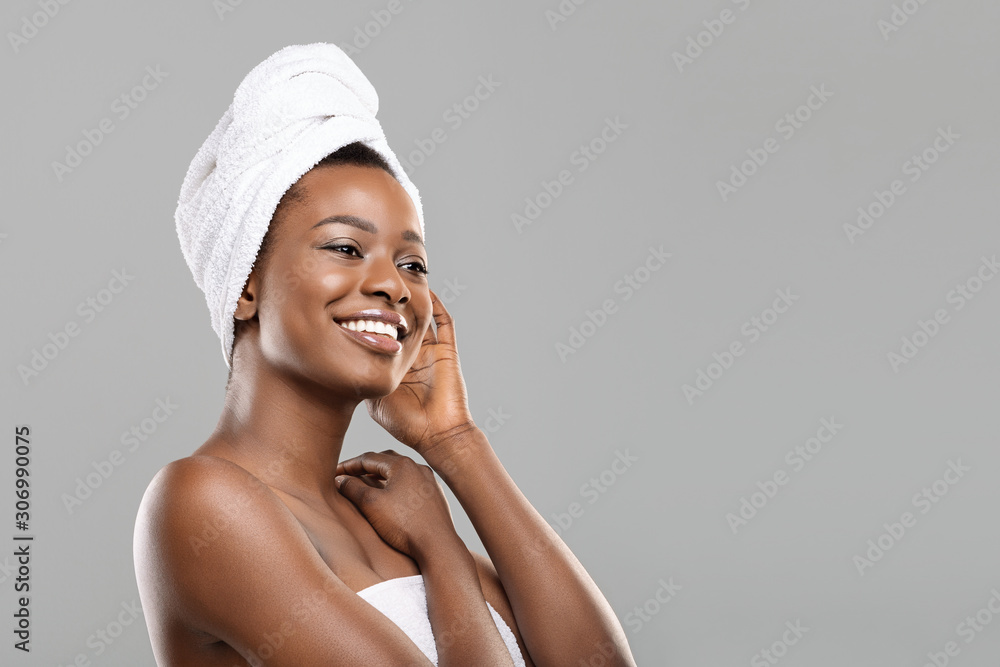 Portrait of afro woman with towel on head and perfect skin Portrait of afro woman with towel on head and perfect skin
