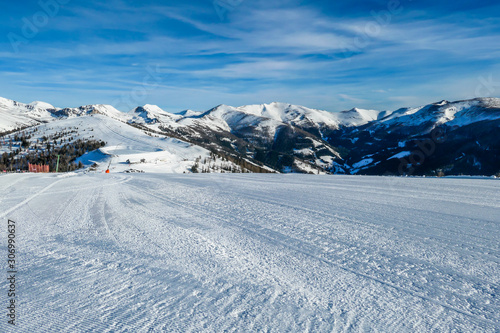 View on the austrian alps in Bad Kleinkirchheim, Austria. Big ski resort. The slopes are perfectly gravelled. Lots of snow capped mountains. Winter sports in Alpine winter wonderland © Chris