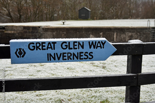 Signpost for the Great Glen Way pointing towards Inverness. This is a famous long distance trail and cycling route in the Scottish Highlands. Taken in winter at Corpach near Fort William photo