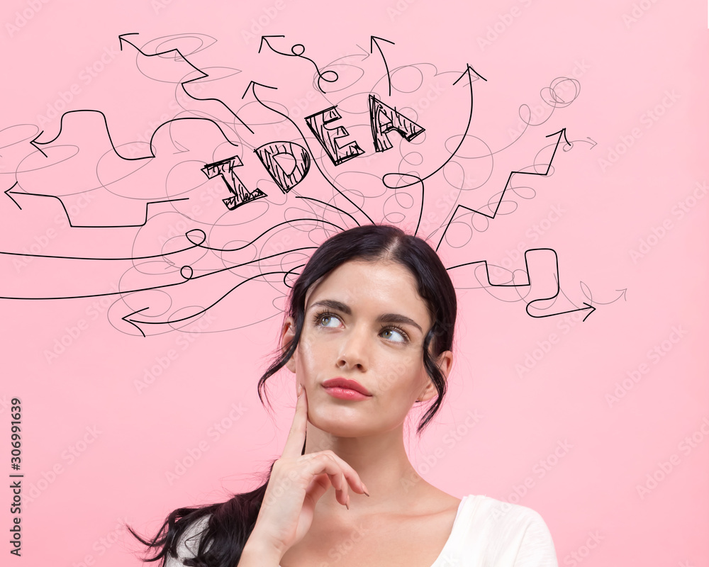 Brainstorming idea arrows with young woman in thoughtful pose Brainstorming idea arrows with young woman in thoughtful pose