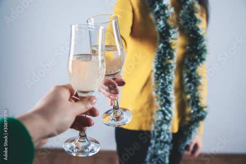 two woman hands a glass of champagne